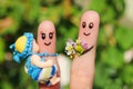 Finger art of a Happy family holding a small child.