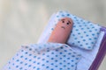Finger art of lonely man sleeping alone in bed. Concept of loneliness Royalty Free Stock Photo