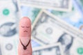 Finger art of a lonely sad man on the background of money Royalty Free Stock Photo