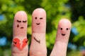 Finger art of people. Man flirts with woman. Other girl is holding broken heart.