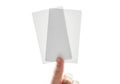 Finger balancing stack of white paper cards Royalty Free Stock Photo