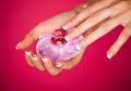 Finger with beautiful manicure touch a orchid Royalty Free Stock Photo