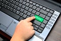 Finger of chind pushing the button of keyboard Royalty Free Stock Photo