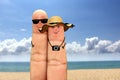 Finger couple face on vacation at the beach