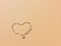 Drawn heart on the sand, symbol of love Royalty Free Stock Photo
