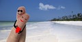 Couple in love on a honeymoon on a tropical white sand beach