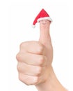 Finger face in Santa hat. Concept for Christmas day. Isolated on