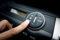 Finger on Fan switch of a Car air conditioning system Royalty Free Stock Photo