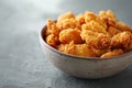 Finger food A dish of deepfried chicken nuggets on a table