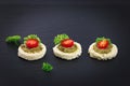 Finger food for party Homemade Canape pesto sauce on top tomato and parsley leaf