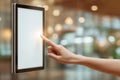 Finger interacts with touchscreen display, showcasing engagement with technology in a contemporary office setting Royalty Free Stock Photo
