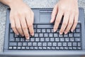 Finger at laptop keyboard. working lifestyle, closeup business woman typing Royalty Free Stock Photo