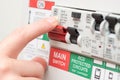 Finger on MAIN Switch on RCD Circuit Breaker Board