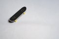 Finger mini skateboard toy on white background