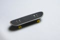 Finger mini skateboard toy on white background.