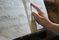 Finger at music sheet