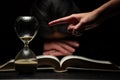 Finger of Person Pointing to Time while Woman Sleeps Over Bible Royalty Free Stock Photo