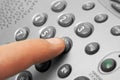 Finger and phone keypad Royalty Free Stock Photo