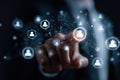 Finger pointing at interconnected digital user icons symbolizing social network and communication technology Royalty Free Stock Photo