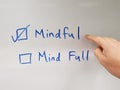 Finger pointing at mindful option. Mindfulness concept. Mindful not mind full. Royalty Free Stock Photo