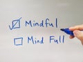 Finger pointing at mindful option. Mindfulness concept. Mindful not mind full. Royalty Free Stock Photo