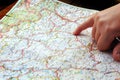 Finger pointing navigation travel map Royalty Free Stock Photo