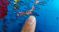 Finger pointing to the country of Japan on a Globe Royalty Free Stock Photo