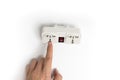 Finger pointing to power plug socket Royalty Free Stock Photo