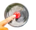 Finger pointing and about to press red machine engine stop button, white background, isolated Royalty Free Stock Photo