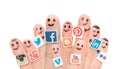 Finger with popular social media logos printed on paper.