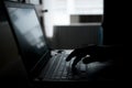 Finger press button on laptop keyboard in the dark tone Royalty Free Stock Photo