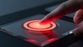 Finger presses a glowing red stop button on a modern device with a dark background Royalty Free Stock Photo