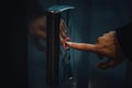 Finger pressing butoom of the elevator. Dark shot of a woman`s hand pushing the lift up button. Going up, ambitions, perspective, Royalty Free Stock Photo