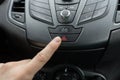 Finger pressing car emergency light button Royalty Free Stock Photo