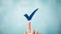 Finger pressing checkmark on digital interface Royalty Free Stock Photo