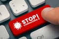 Finger pressing computer key with stop coronavirus word and symbol Royalty Free Stock Photo