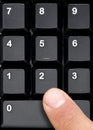 Finger Pressing Computer Keyboard Numeric Keys Royalty Free Stock Photo