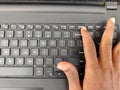 Finger pressing a Delete button on the laptop Royalty Free Stock Photo