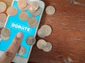 Donation money online by smart phone Royalty Free Stock Photo