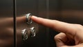 Finger pressing elevator button showcasing accessibility and modern convenience Royalty Free Stock Photo