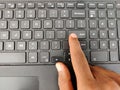 Finger pressing a Enter button on the laptop Royalty Free Stock Photo