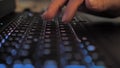 Finger pressing an enter key. Computer user hitting the enter key, up close. Confirmation, sending a message