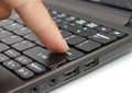 Finger pressing the Enter key on a keyboard Royalty Free Stock Photo