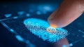 Finger pressing on futuristic fingerprint scanner with blue digital interface for secure biometric authentication and advanced Royalty Free Stock Photo