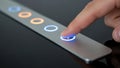 Finger Pressing Illuminated Blue Button on Sleek Silver Panel, Modern Technology Royalty Free Stock Photo