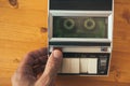 Finger pressing record button on vintage audio cassette tape player Royalty Free Stock Photo