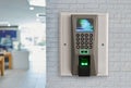 Finger print scan machine on brick wall. Royalty Free Stock Photo