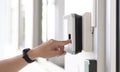 Finger print scan, Male employees press sensors to record company attendance time and after work