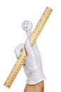 Finger puppet holding metric and inch ruler