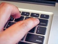 Finger pushing delete button on a keyboard of computer Royalty Free Stock Photo